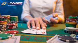 a blackjack dealer has a pair of aces with chips on the side